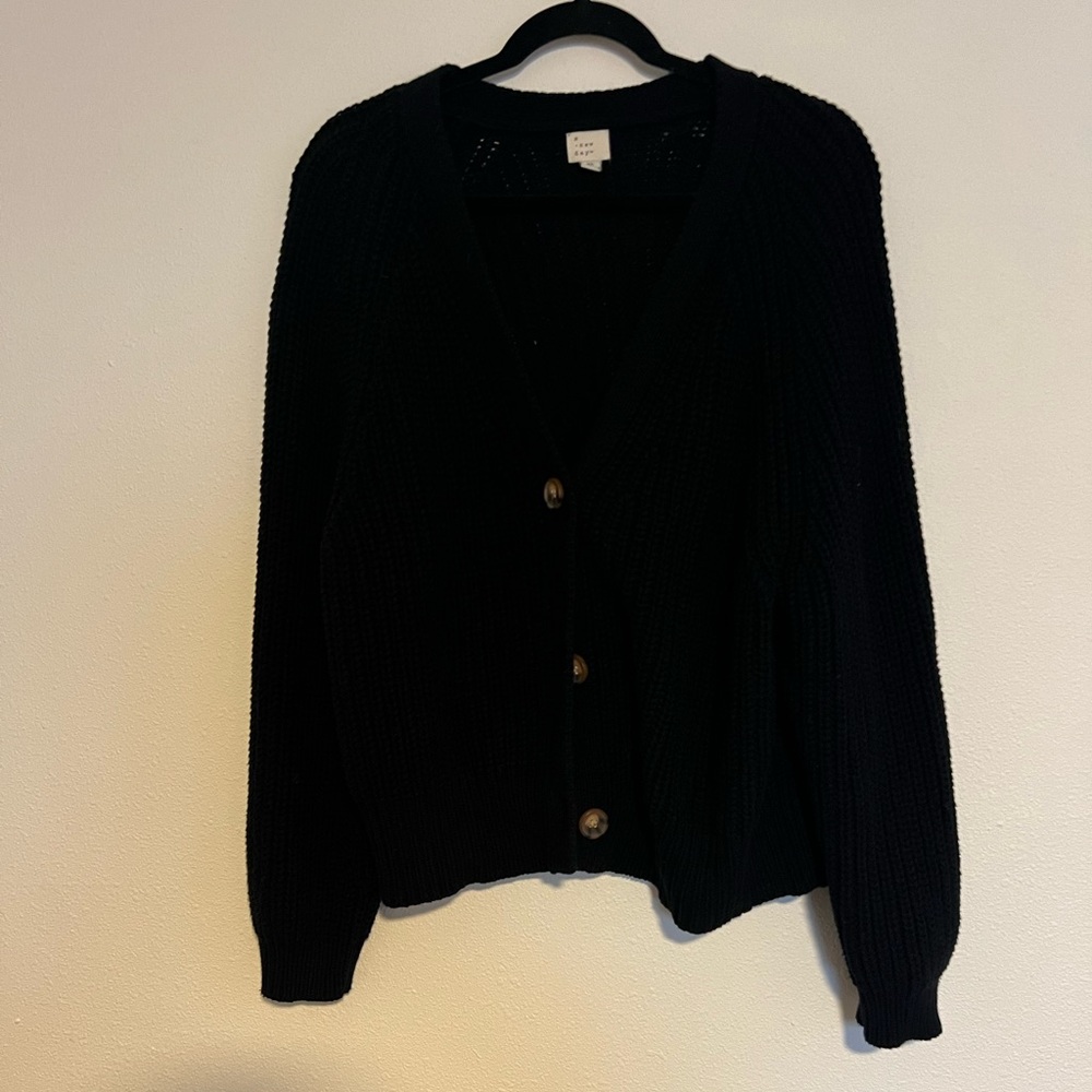 Super cute button up black knit sweater. Size XL